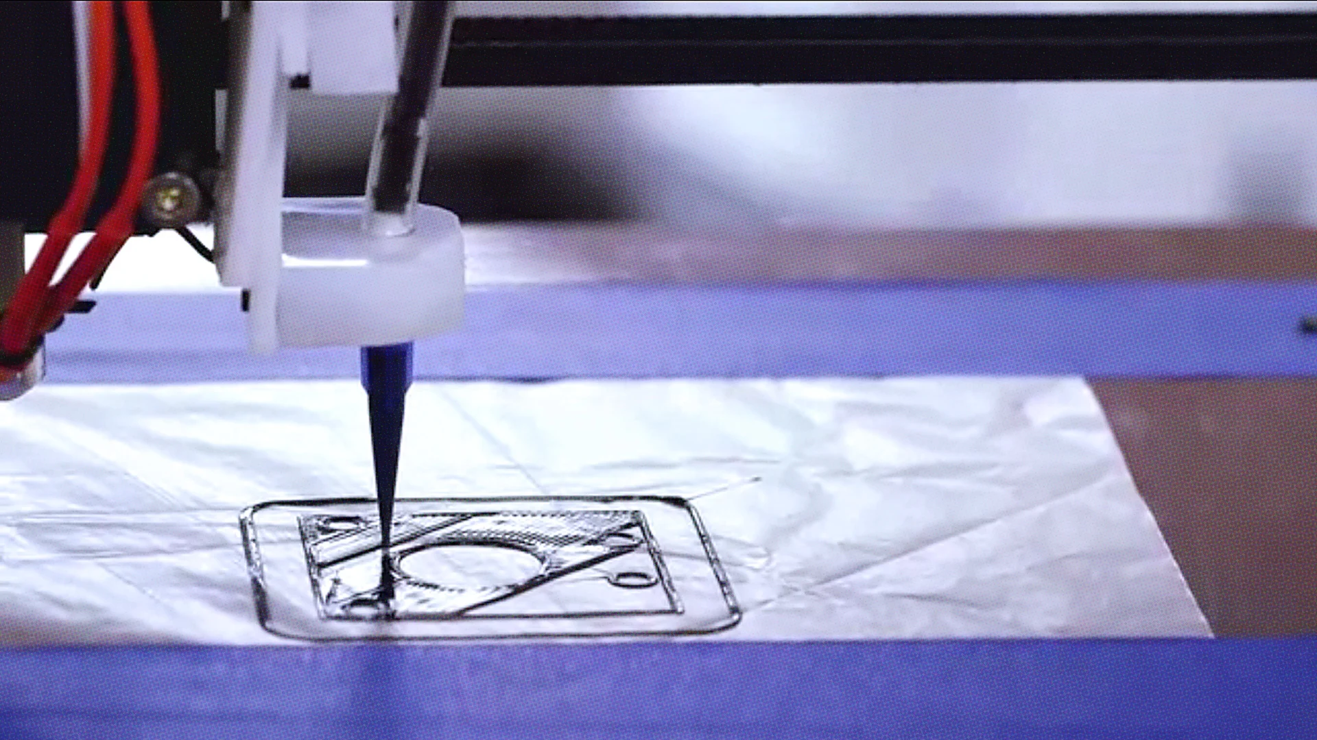 A Discov3ry nozzle printing a soft-material phone case.